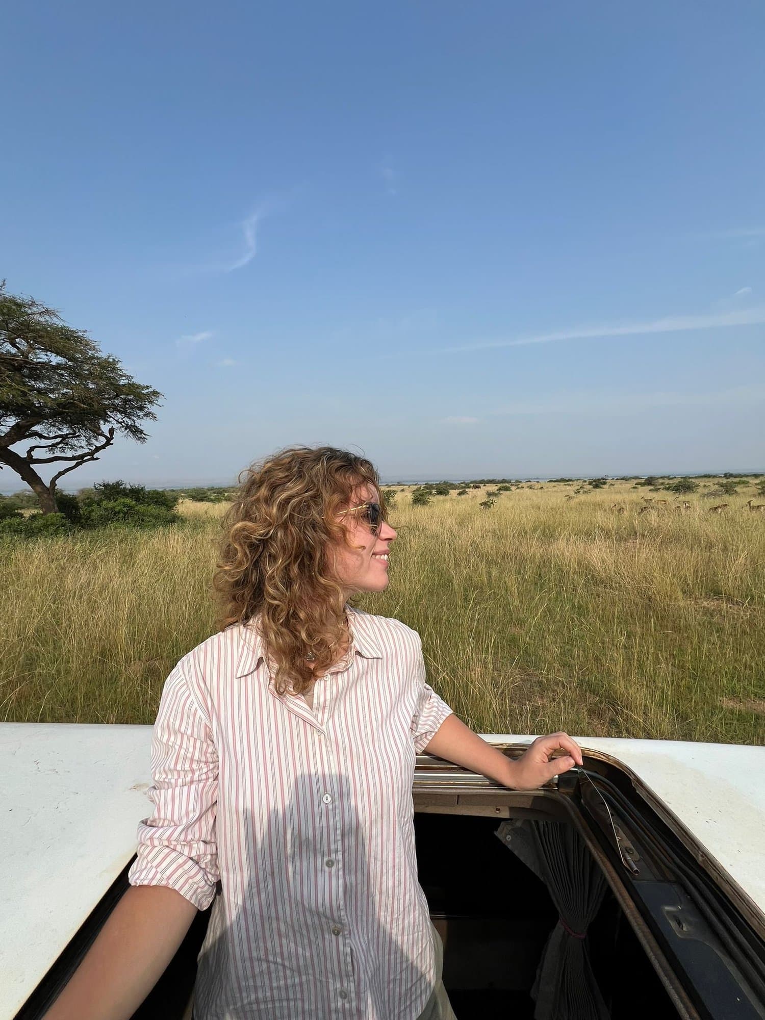Standing through the safari roof hatch over the savanna